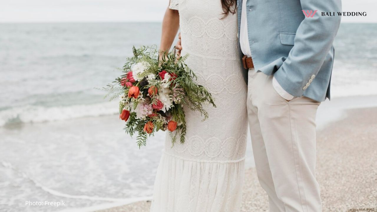 Man and woman having a beach wedding