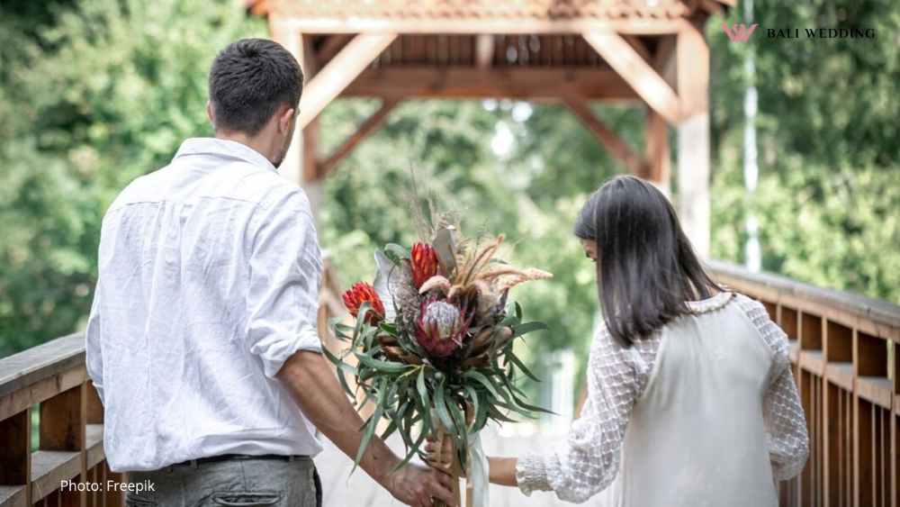 a couple in love holding a bouquet