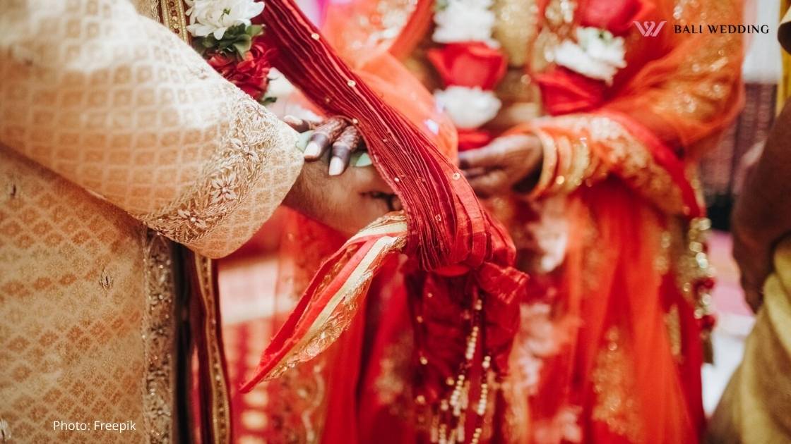 Ritual with coconut leaves during traditional Hindu wedding ceremony