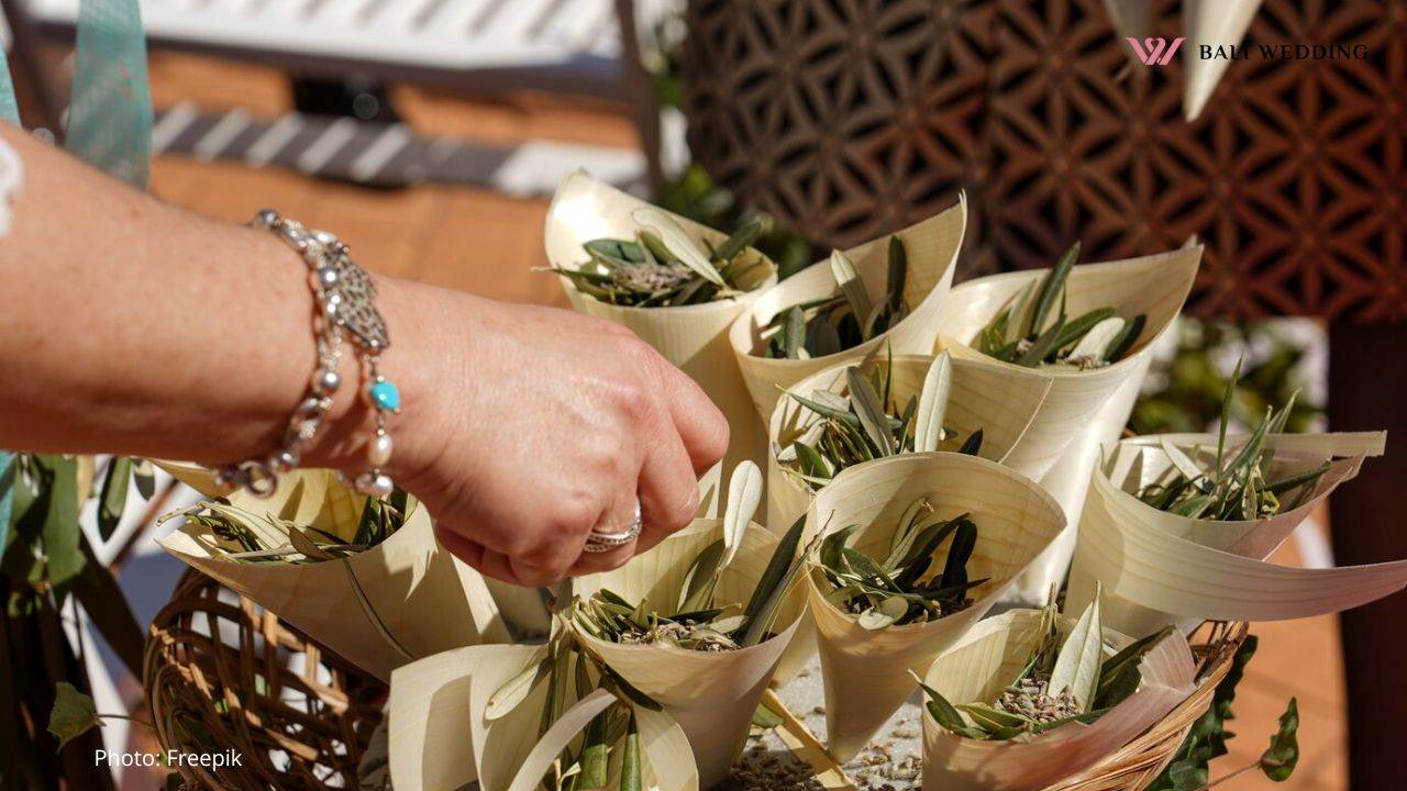 Closeup shot of a female hand touching the small wedding floral bouquets