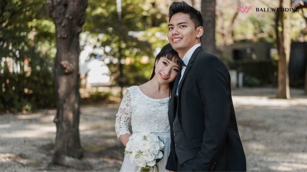 Smiley newlyweds posing together outdoors