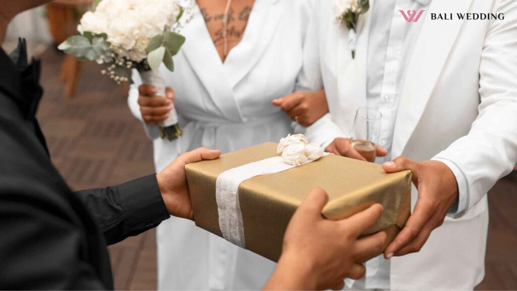 couple accepting gifts from guests at their wedding