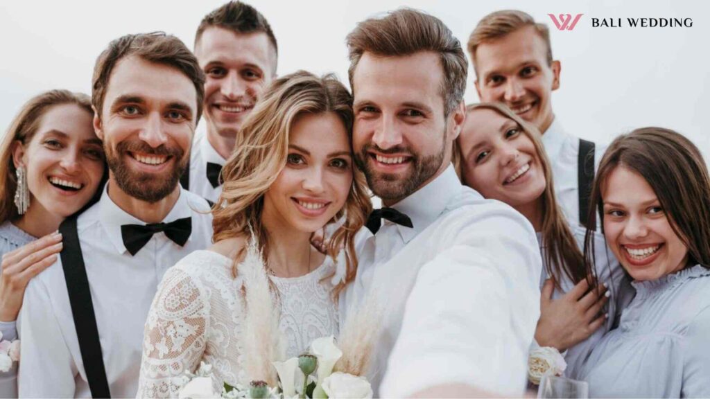 Beautiful bride and groom having their wedding with guests on a beach