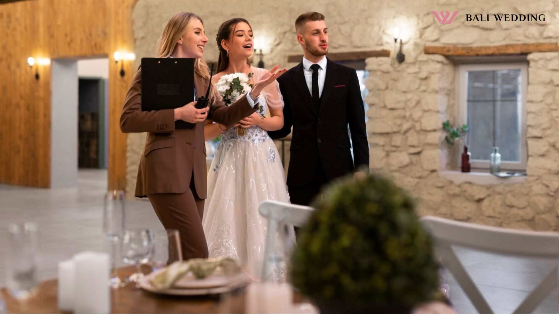 Female wedding planner working with bride and groom