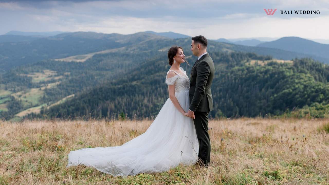 Groom and bride are standing in front of each other