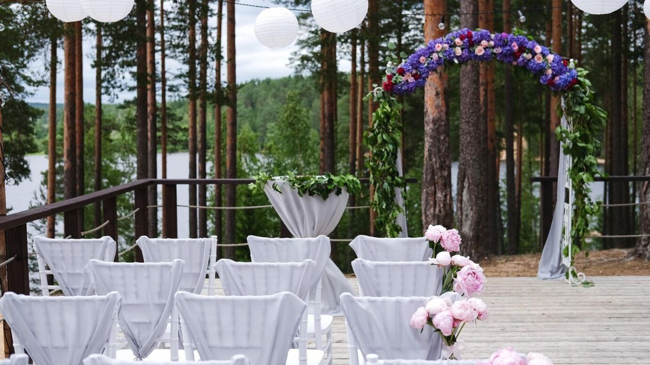 a stunning cliffside ceremony setup with bamboo decorations