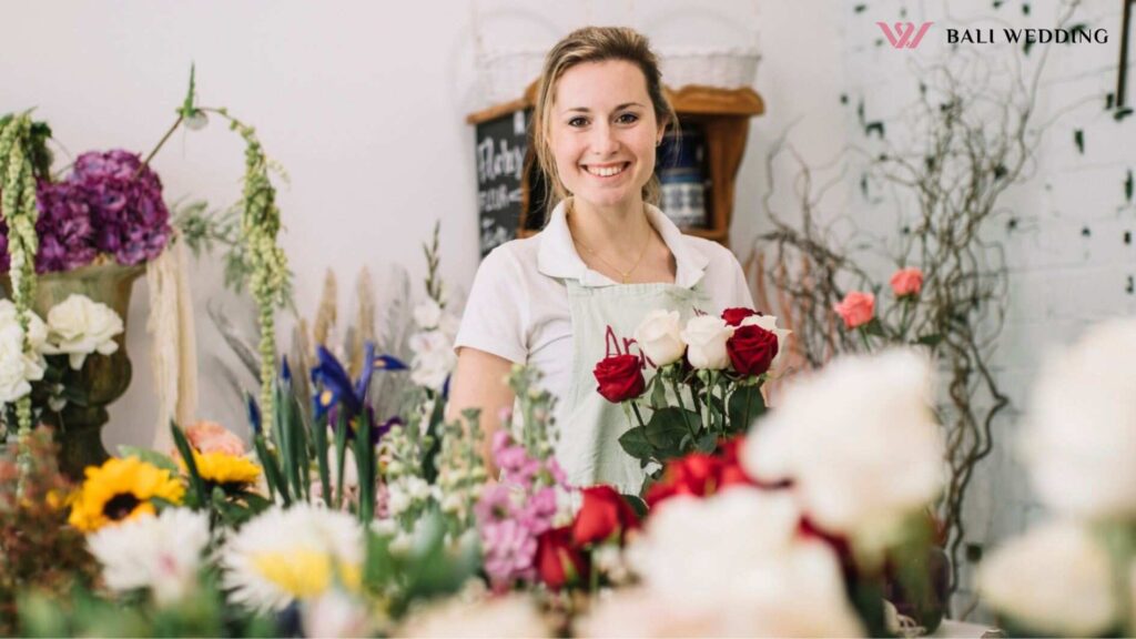Content woman in flower shop
